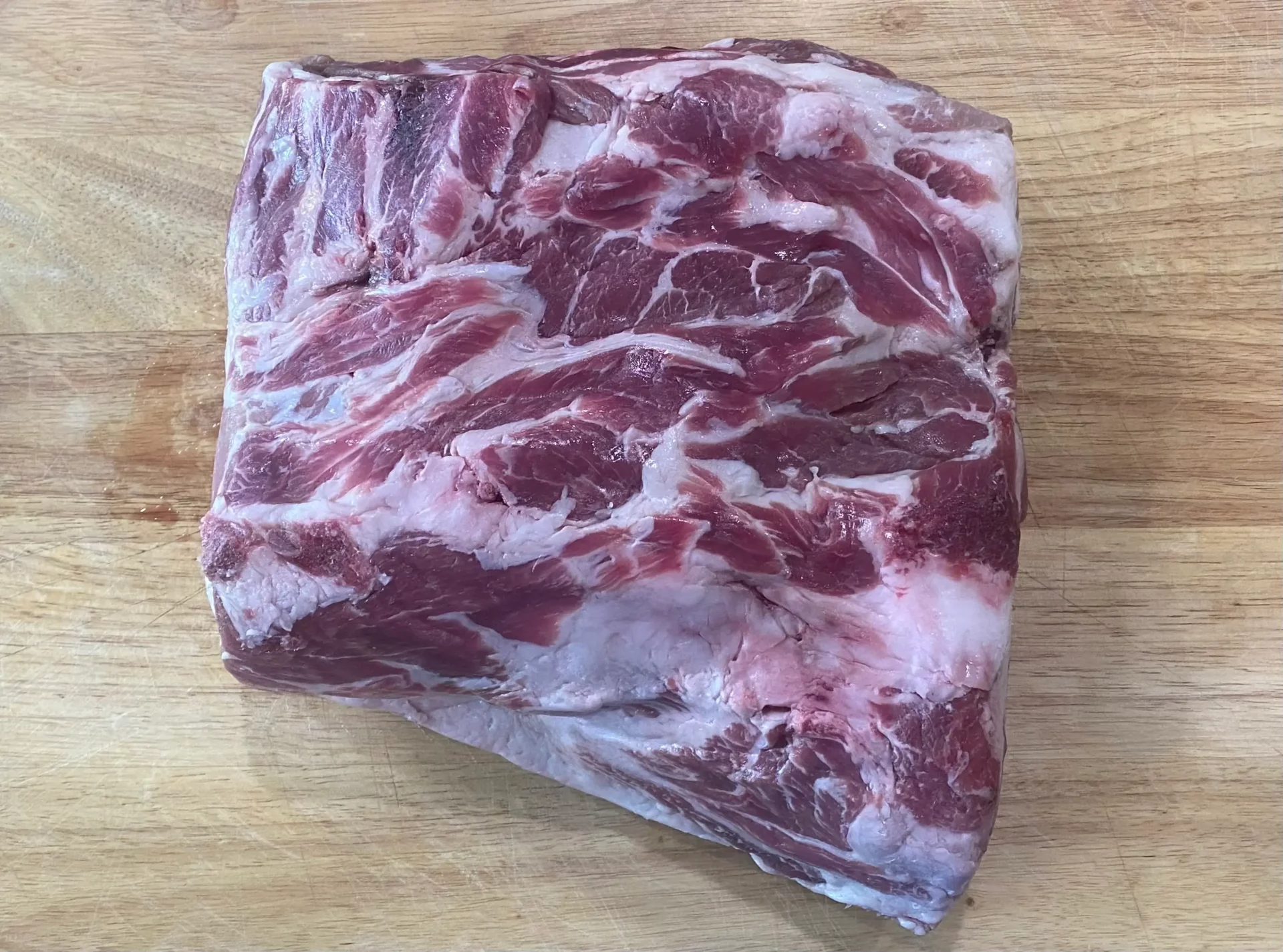 A raw Pork Shoulder Roast from Project FarmSTAND's heritage pork that's ready to cook