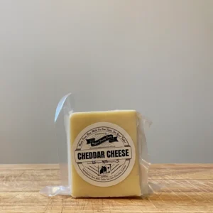 Shop Raw Milk Cheese from Hufford Family Dairy. Block of cheddar cheese, homegrown in Indiana from cows fed a non-GMO diet. Made with raw milk, Celtic sea salt, enzymes & culture.