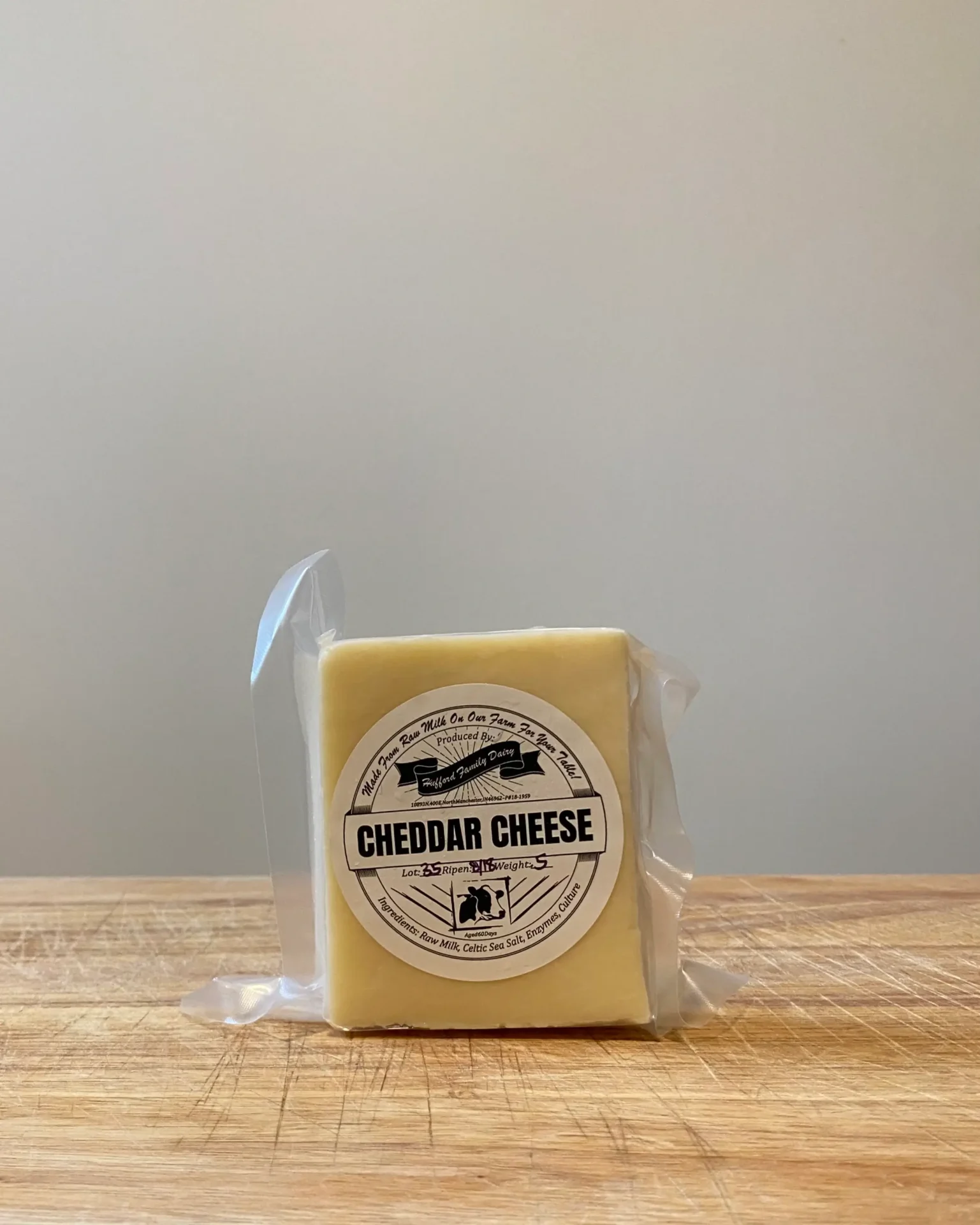 Shop Raw Milk Cheese from Hufford Family Dairy. Block of cheddar cheese, homegrown in Indiana from cows fed a non-GMO diet. Made with raw milk, Celtic sea salt, enzymes & culture.
